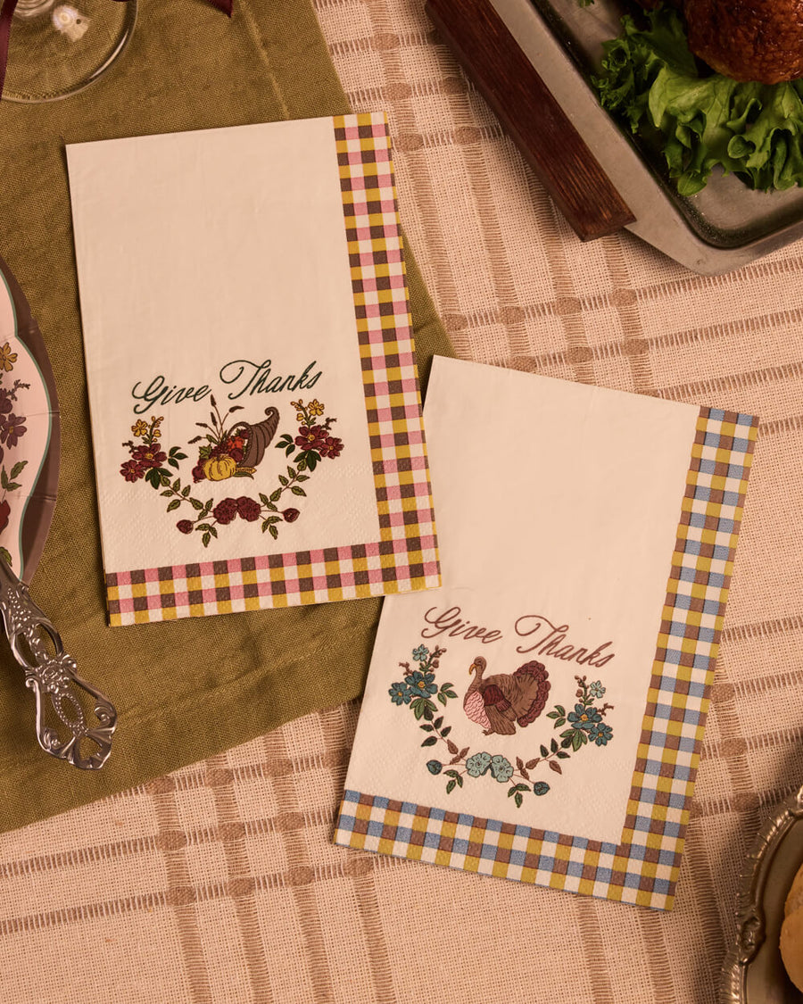 Give Thanks harvest napkins styled on a Thanksgiving table