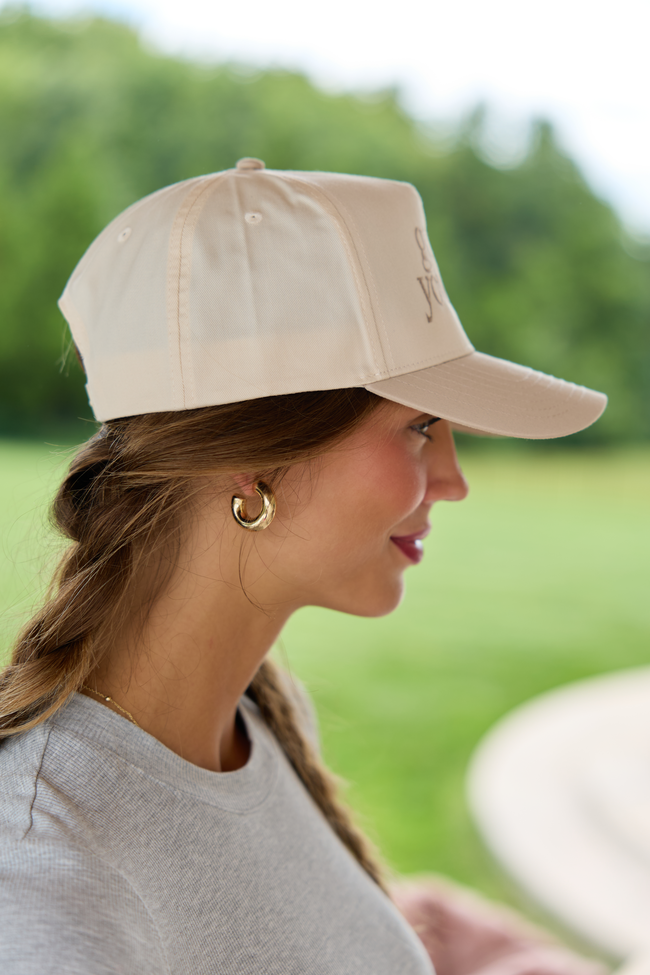 Natural hat with khaki go ask your dad embroidery, shown from the front.
