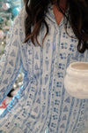 Close up of Buttery Soft Bamboo Blue Christmas Pajama Set, Printed with Christmas trees, ornaments, trees