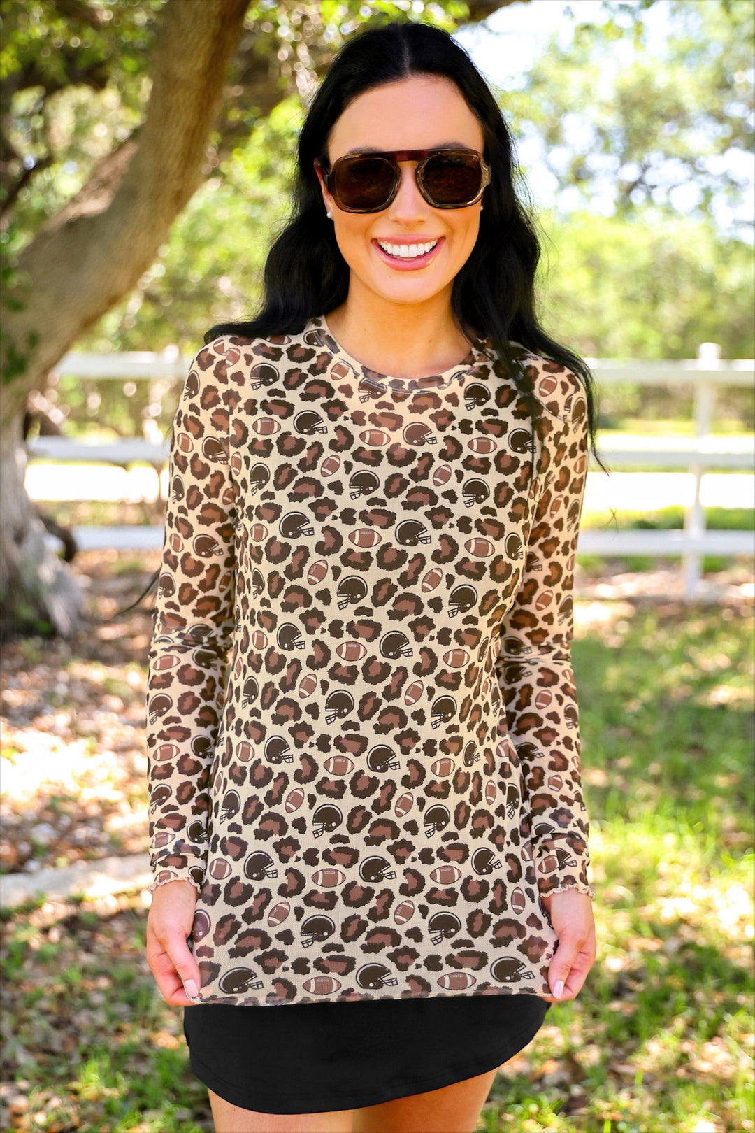 Model wearing Alyssa Game Day leopard mesh top