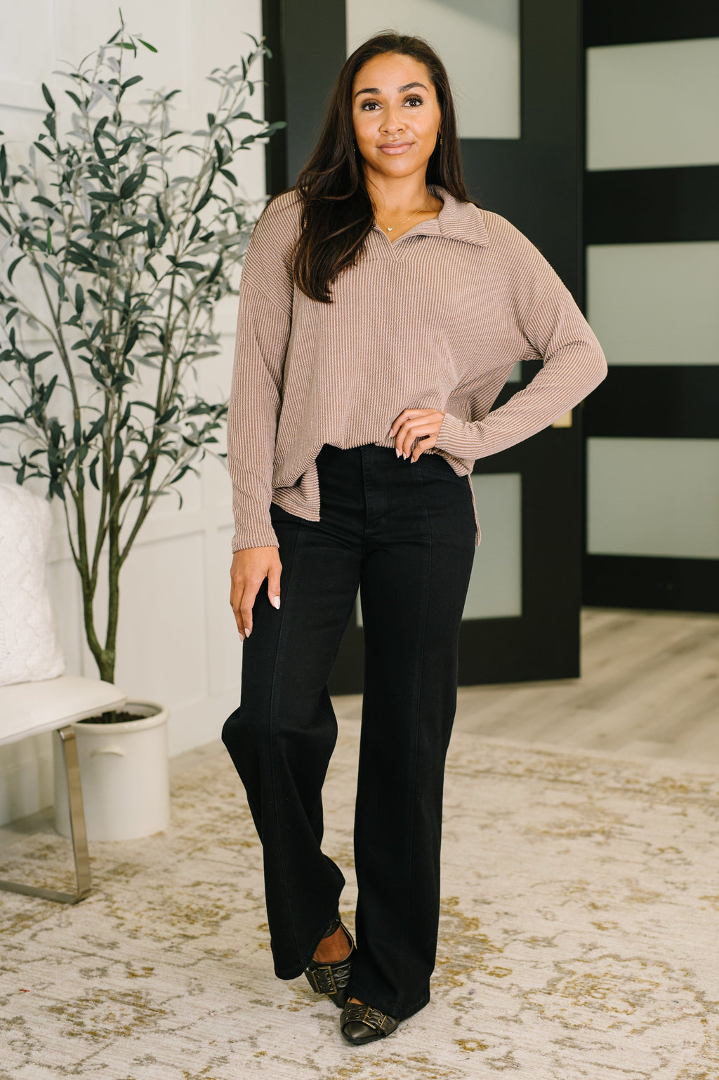 Front view of a taupe collared ribbed-knit pullover with long sleeves