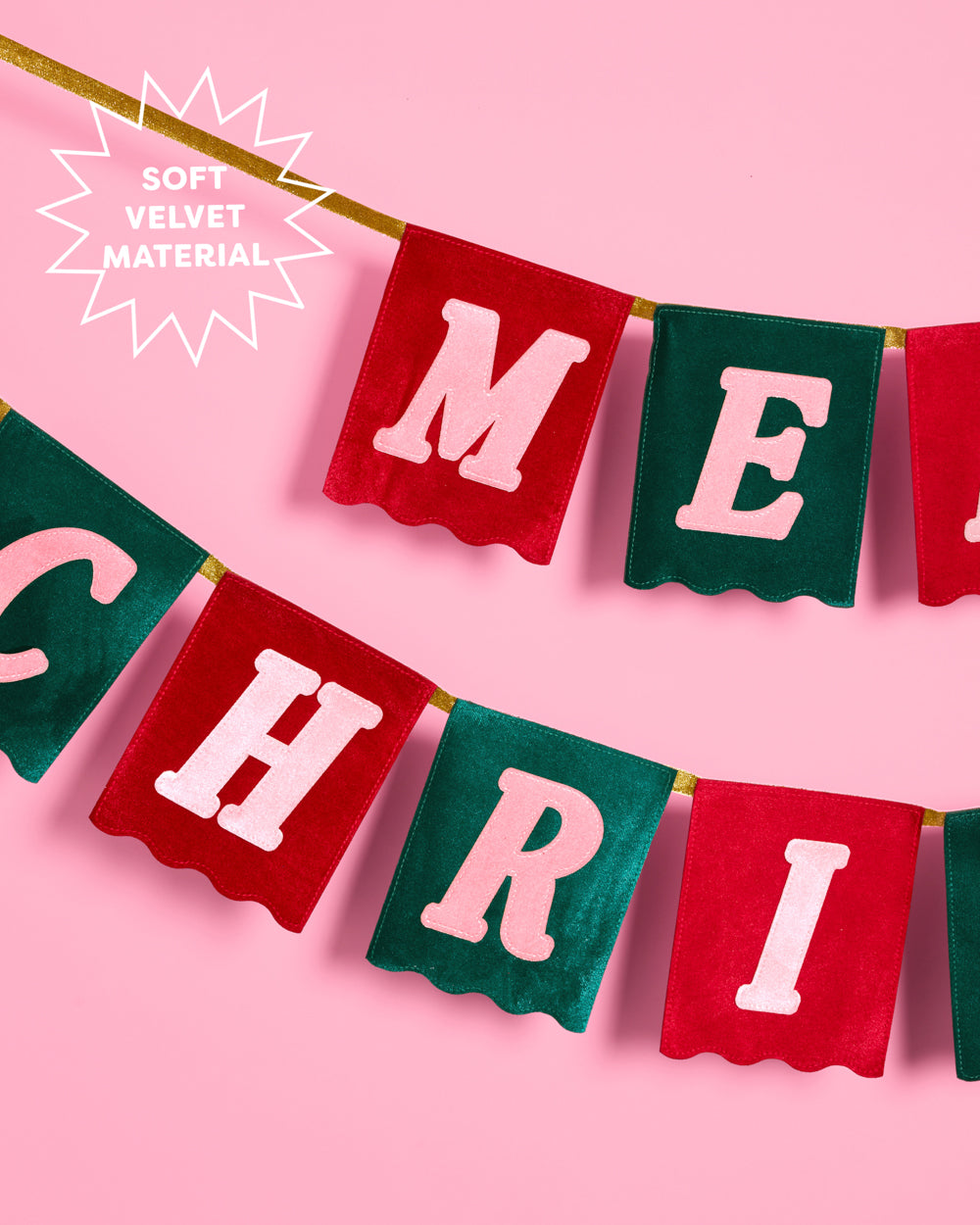 Red and green Merry Christmas velvet flag banner hanging above a stone fireplace.